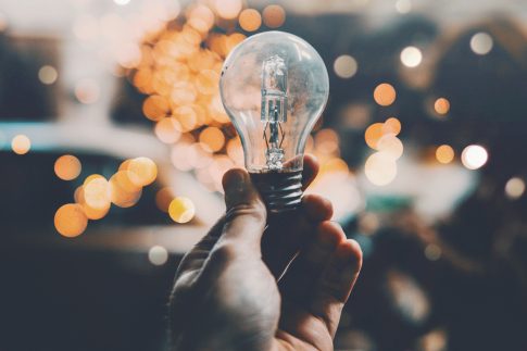 man holding a light bulb